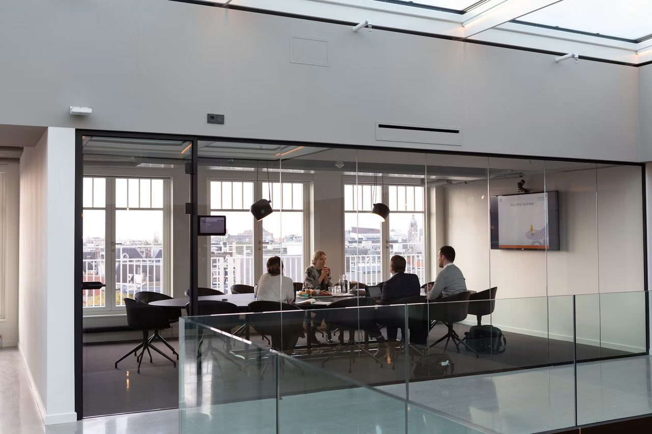 A project team meeting in a bright conference room